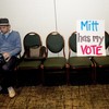 A supporter of US Republican presidential candidate Mitt Romney watches polling results on his computer on February 28, 2012 at his victory party celebration in Phoenix, Arizona.
